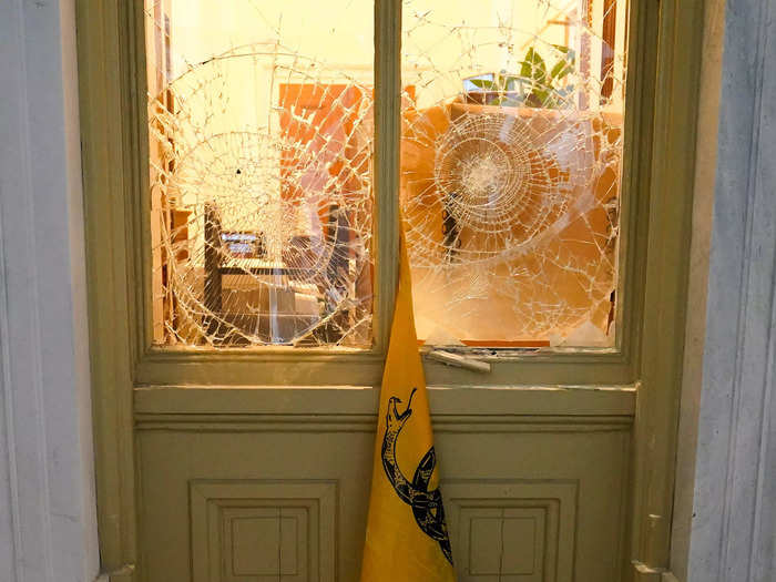 Broken glass window at Capitol