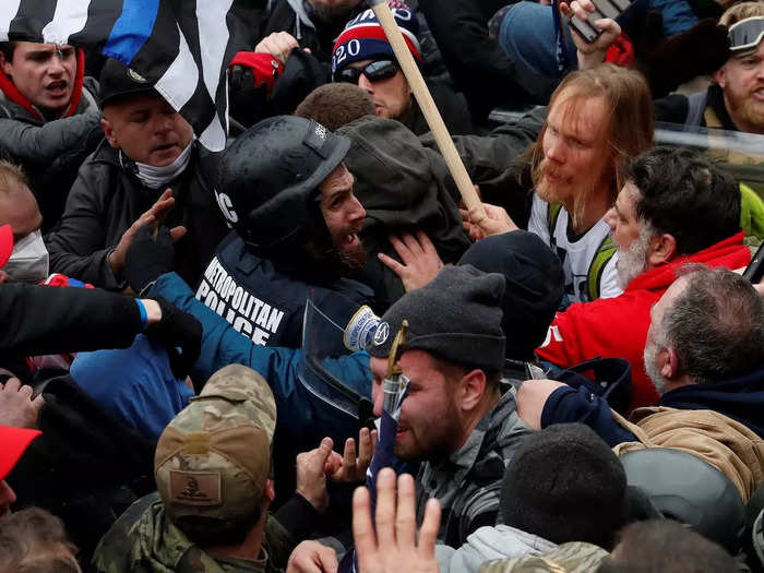 Pro-Trump protesters surround and assault D.C. police officer Michael Fanone during the Capitol riot on Jan. 6, 2021.