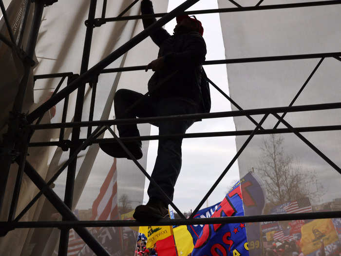 Capitol rioter climbs scaffolding on January 6