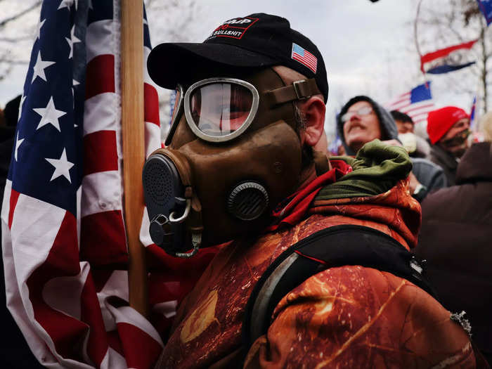 A man wearing a gas mask on the way from the rally at the Ellipse to the Capitol.