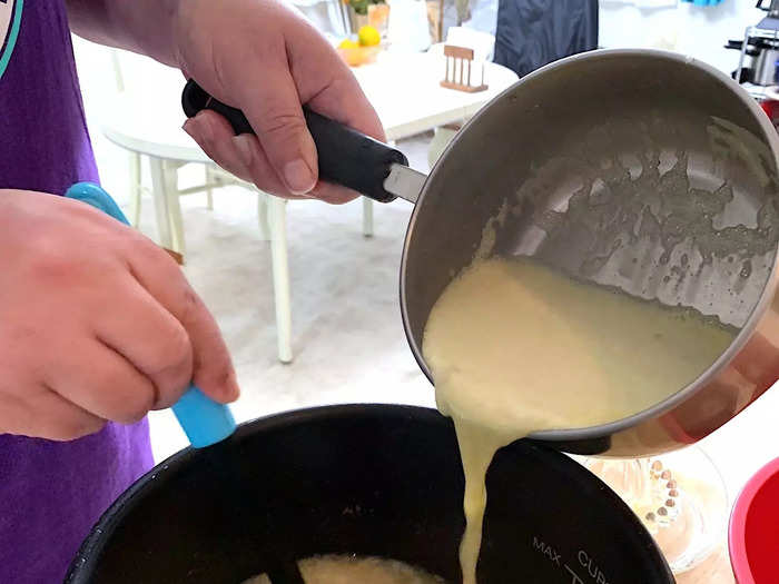 Then take your avgolemono-broth mixture and pour it back into the big pot.