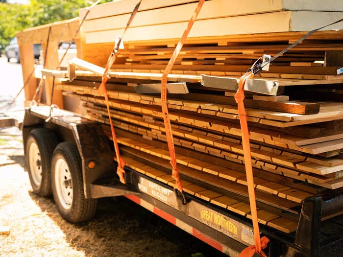 These panels are then trucked to the backyards to be assembled on-site with the help of volunteers.