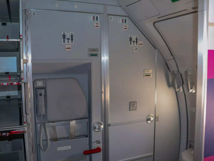The rear galley of the aircraft is configured with a minimal workstation for flight attendants that