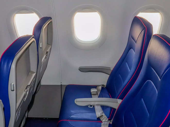Only very basic amenities exist at each seat including a tray table, coat hook, and a seatback pocket.