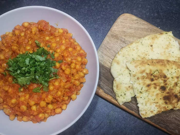 Serve the curry at a piping hot temperature with lightly-toasted garlic naan or plain naan.