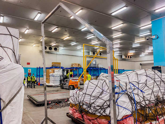 Back in Emirates’ cargo warehouse, workers use frames based on the curvature of the aircraft to ensure that pallets will fit inside the aircraft.