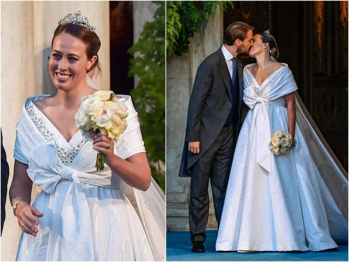 Princess Nina of Greece wore a couture wedding gown with a V-neck, a bow at the front, and a train reminiscent of a cape in 2020.