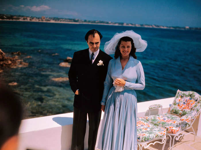 Rita Hayworth chose a non-traditional blue wedding dress for her 1949 wedding to Prince Aly Khan of Pakistan.