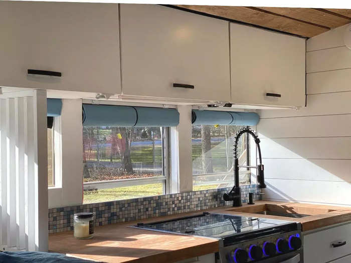 In the kitchen area, there are hand-built cabinets by Manny intended to maximize space.