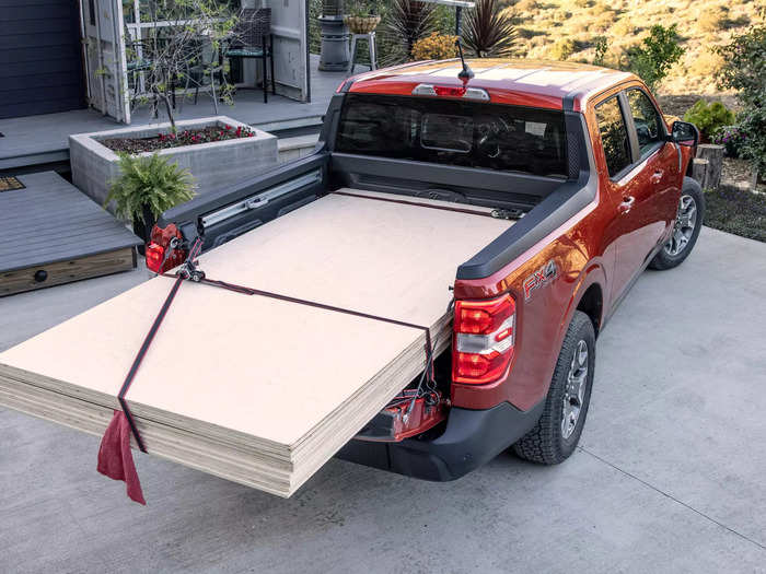 In its elevated position, the tailgate is designed so owners can lay sheets of plywood across the tailgate