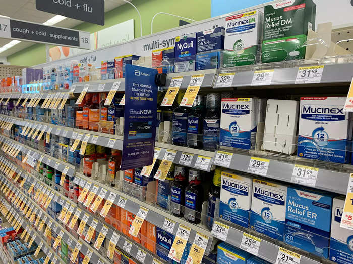 Over-the-counter medications for cold and flu are stocked nearby.