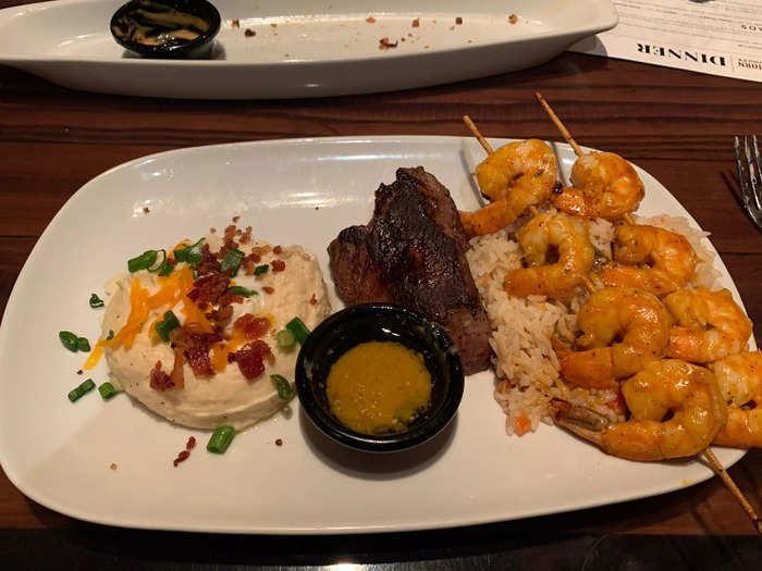 Next came our entrees. I got a sirloin and grilled shrimp over rice, with loaded mashed potatoes as my other side.