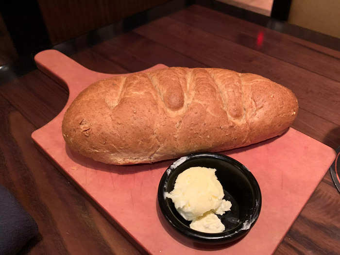 Next, the waitress brought us a loaf of bread and a little dish of butter.