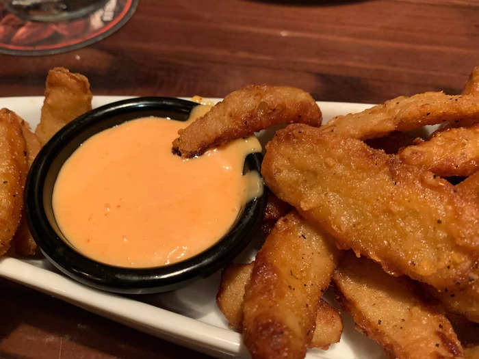 They were fried onion slices with a slightly zesty dipping sauce.