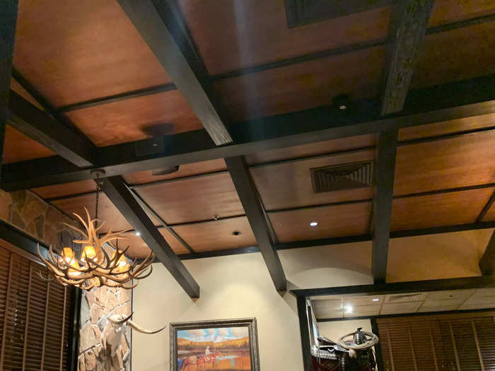 The ceilings have dark wood beams, almost reminiscent of a farm.