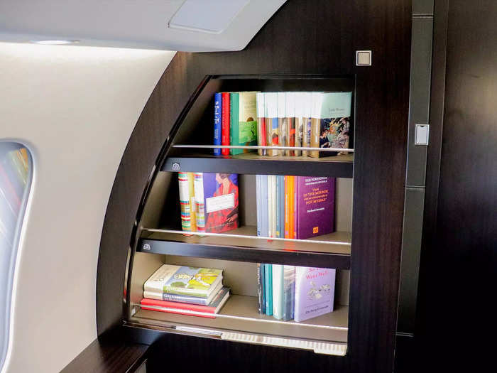 Also included in the suite is a sizeable entertainment screen alongside a small bookshelf that VistaJet always keeps well stocked.