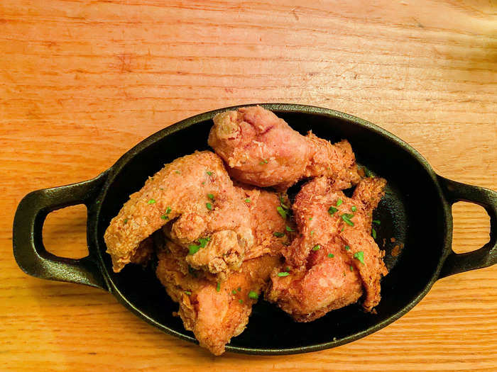 Within five minutes of placing my order, there was a cast-iron skillet of four crispy chicken pieces in front of me.