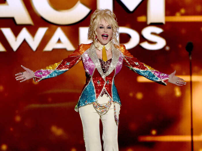 In a literal coat of many colors, Parton celebrated her TV movie at the 51st Academy of Country Music Awards in 2016.