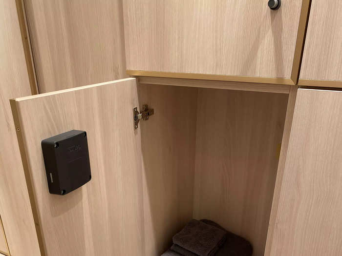 The changing rooms are simple but stylish, each locker containing a robe, slippers, and towels.