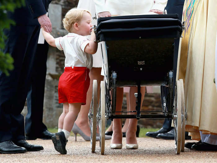 He caught Prince George peeking into Princess Charlotte