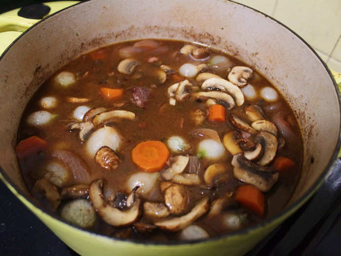 After mixing in the butter, flour, frozen pearl onions, and mushrooms, I brought the pot to a boil on top of the stove, then lowered the heat and simmered it for another 15 minutes.