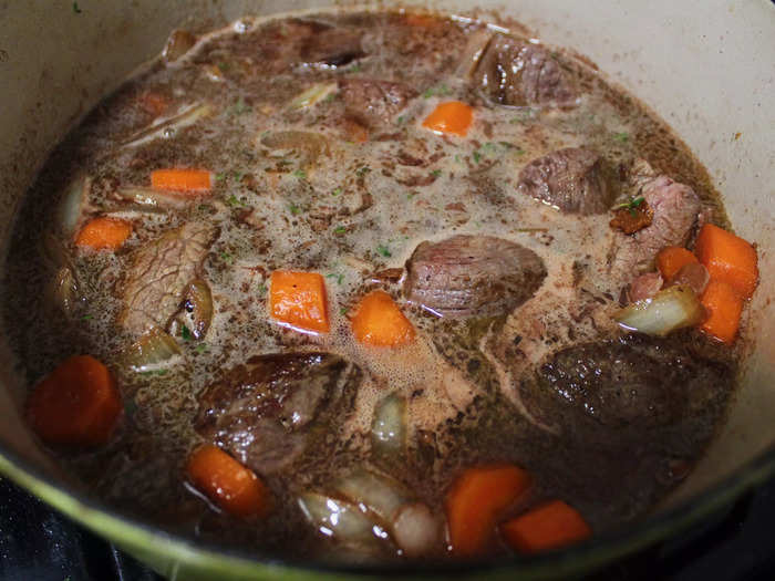 I then added enough wine and beef broth to almost cover the meat, following Garten