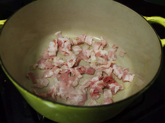 I started by dicing the bacon and sautéing it in olive oil in a large Dutch-oven pot similar to the one I used for Julia Child