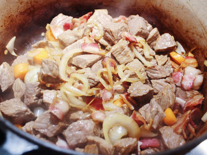 At this point, Child recommends putting the pot into the oven for four minutes, tossing the contents, and putting it back in the oven.