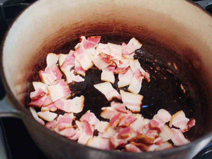 After straining the bacon with a slotted spoon and placing it on a paper towel to dry, I lightly browned it in my well-loved Le Creuset Dutch oven.