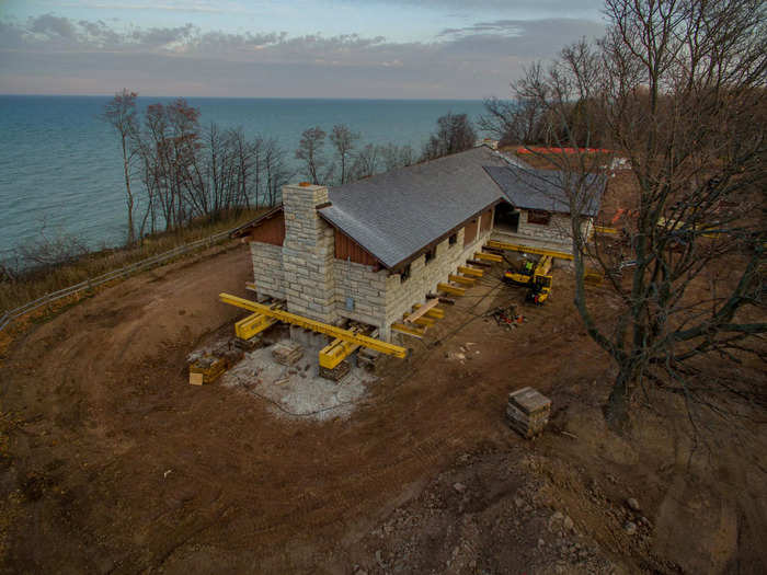 The historic landmark was moved 1500 feet on 27 Buckingham Dollies with "its two fireplaces, concession side room, restrooms, and concrete slab floor" intact, Wolfe House Movers said.