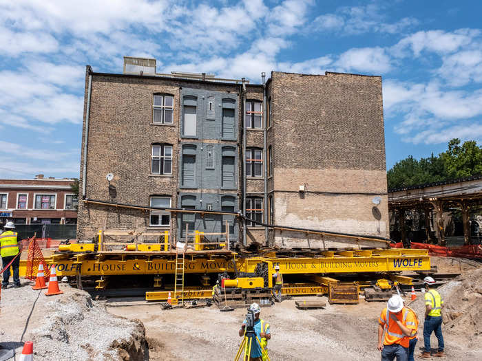 The historic structure weighed 840 tons and required "several layers of steel beams, unified jacking machines, X/Y skates, and push-pull rams" to slide it 30 feet west and 4 feet south, according to the moving company.