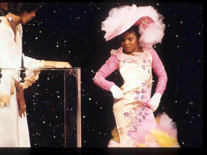 Janet Jackson turned heads at the 1977 American Music Awards in a colorful dress adorned with tufts of tulle and a statement hat.