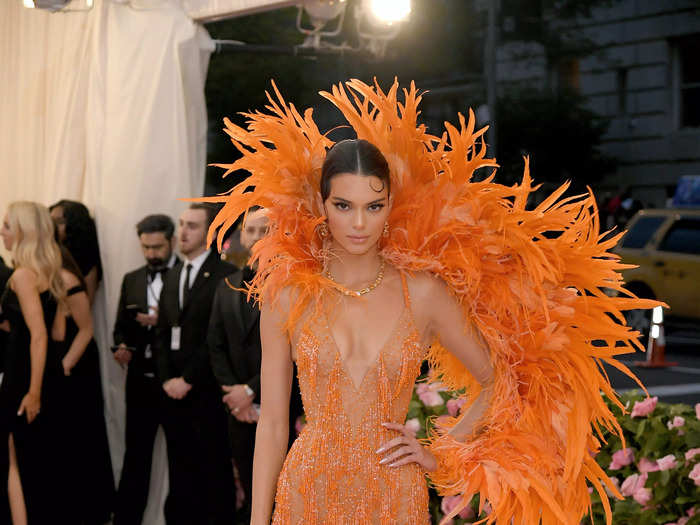 Jenner stunned in a feathered orange gown at the 2019 Met Gala.