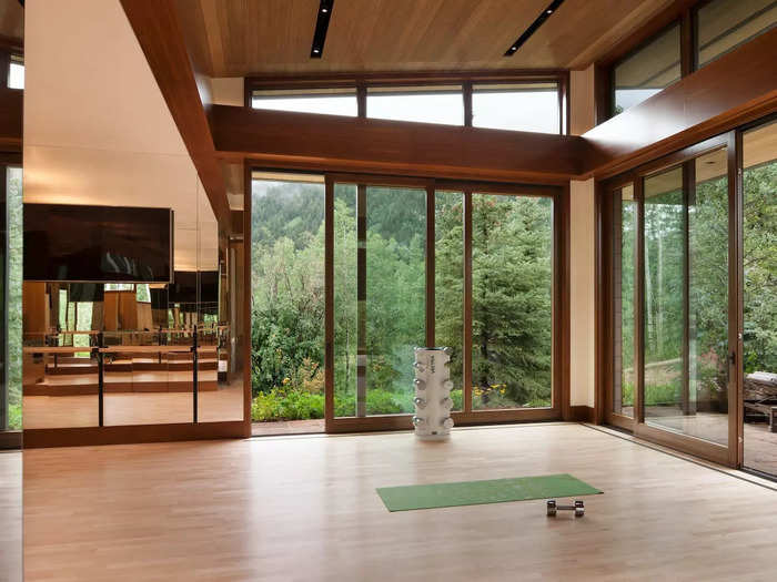 The home also has its own workout studio with 180-degree views of the surrounding forest.