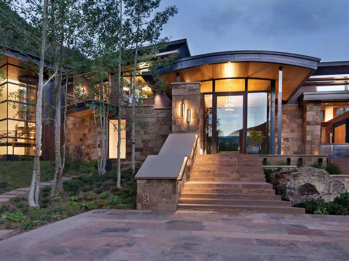 Surrounded by a national forest, Aspen Park is a sprawling 15,000-square-foot home that