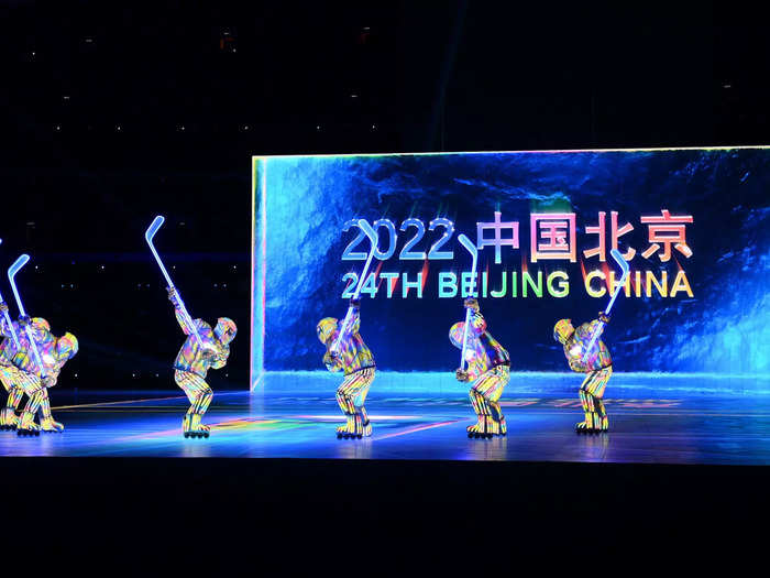 A team of ice hockey players helped kick off the games by firing a giant multi-colored puck across the stadium.