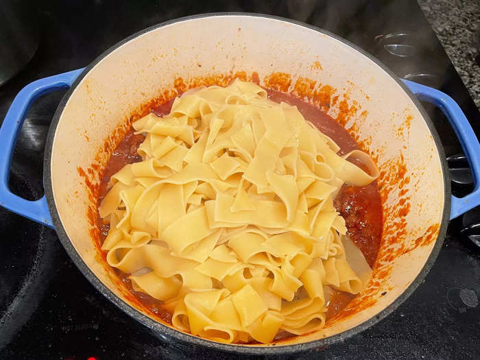 Everything was ready to go! So I dumped my pasta into the Dutch oven and mixed it with the bolognese sauce.