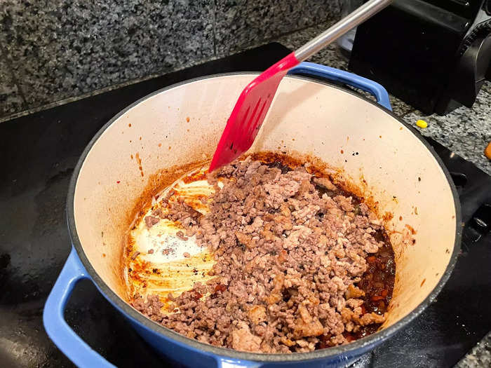 Once the wine had reduced, I added the browned meat back into the Dutch oven.