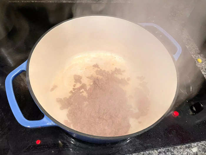 Then I threw some olive oil into a Dutch oven and added the ground beef.