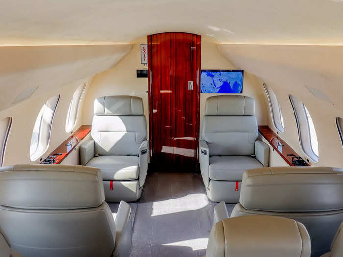 Travelers are first greeted by the club suite, the quintessential aspect of a wide-cabin private jet aircraft that features four seats in total.