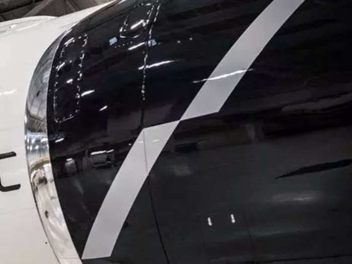 Other features of the plane include two white lines on the engine that represent the wings of a bird and ascension...