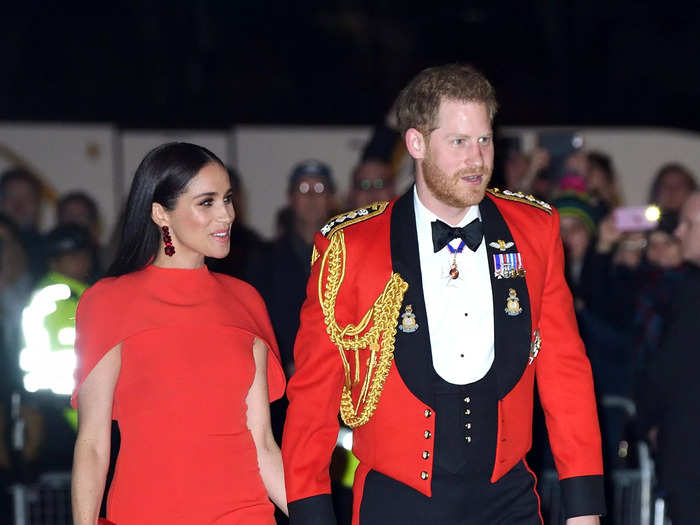 Harry and Markle stunned in monochromatic red looks to attend the Mountbatten Festival of Music in London, England, in March 2020.