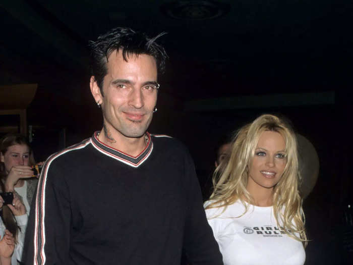 Anderson wore a white crop top and miniskirt to attend a Rolling Stones concert with Lee in 1998.