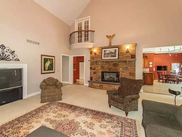 The house is full of architectural quirks, such as this balcony overlooking the living area.