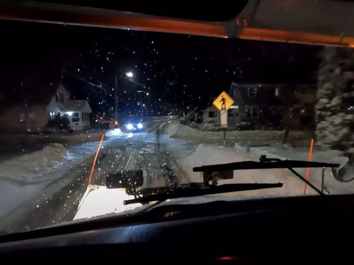 By 10 p.m. the storm has mostly passed and the temperature has fallen to 2° F, so Gaffin spreads salt on the road to melt the remaining snow and ice down to the blacktop.