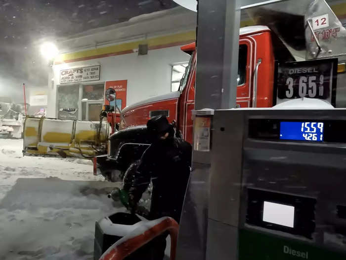 Gaffin chats with a co-worker while they wait for their diesel to dispense.