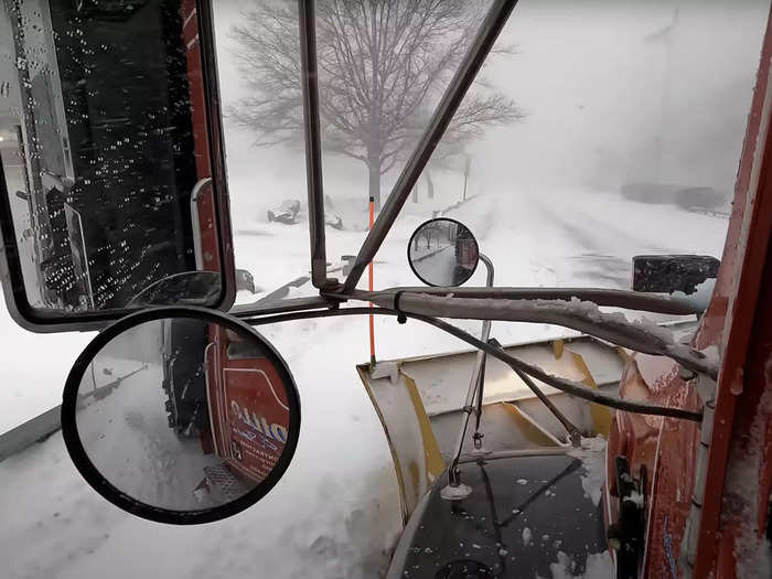 The whiteout conditions conceal the road ahead.