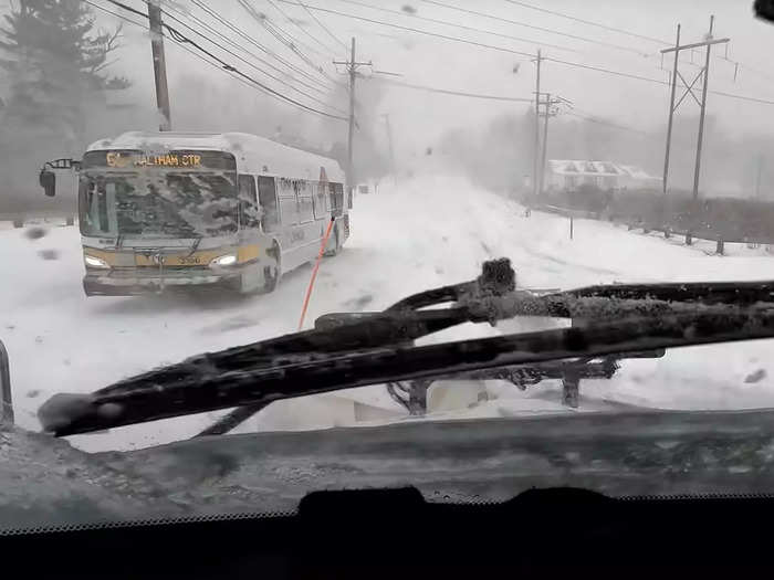 Underway again, he passes a bus crawling carefully up the road.