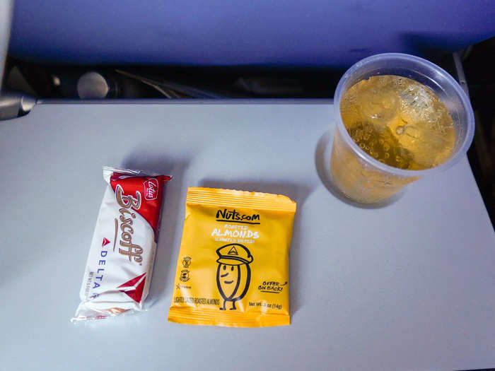 Flight attendants served complimentary snacks and beverages and offered sweet and salty options. They came around three times on the first flight and twice on the second.