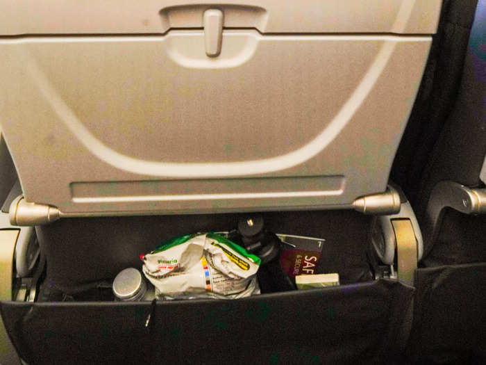 The seat-back pocket was large enough to fit snacks, water, headphones, gum, and my phone. On other planes, I